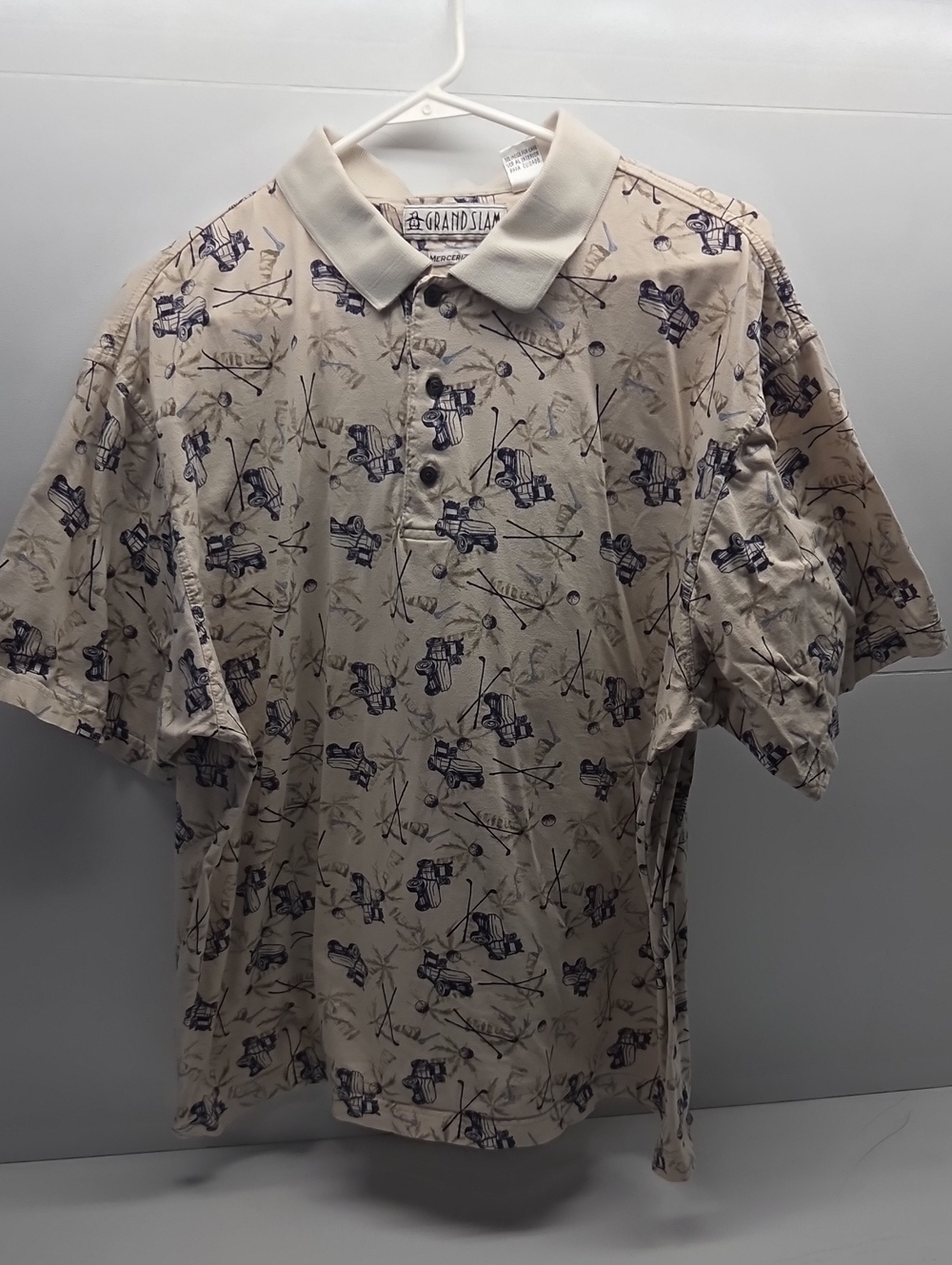 Grand Slam Beige Polo with Navy Golf Motif